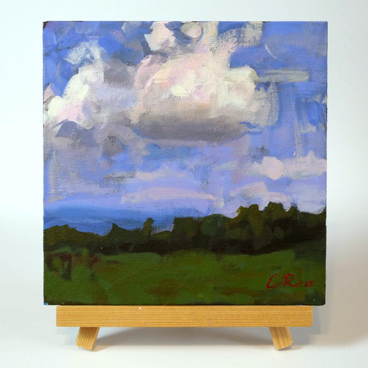 The painting arrives professionally framed; the easel is not included in the price.